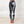 Load image into Gallery viewer, women wearing low waist black and white tie-dye leggings. The leggings are ankle lenght and mae of organic cotton.