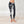 Load image into Gallery viewer, women wearing low waist black and white tie-dye leggings. The leggings are ankle lenght and mae of organic cotton.