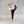 Load image into Gallery viewer, a women performing a yoga pose wearing a white sports bra and black harem yoga pants
